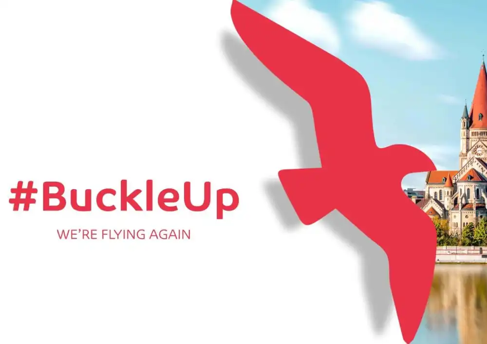 Air Arabia campaign banner with #BuckleUp and We're Flying Again text